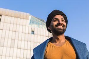 Young Indian man posing in an urban context